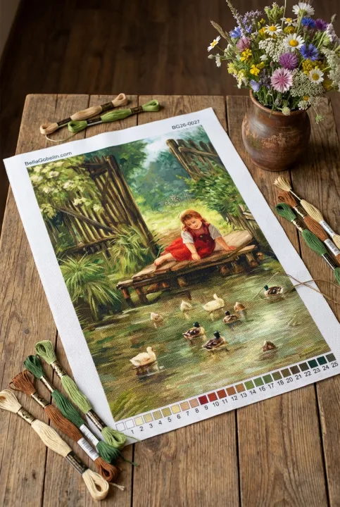 Kleines Mädchen mit Enten am Seeufer