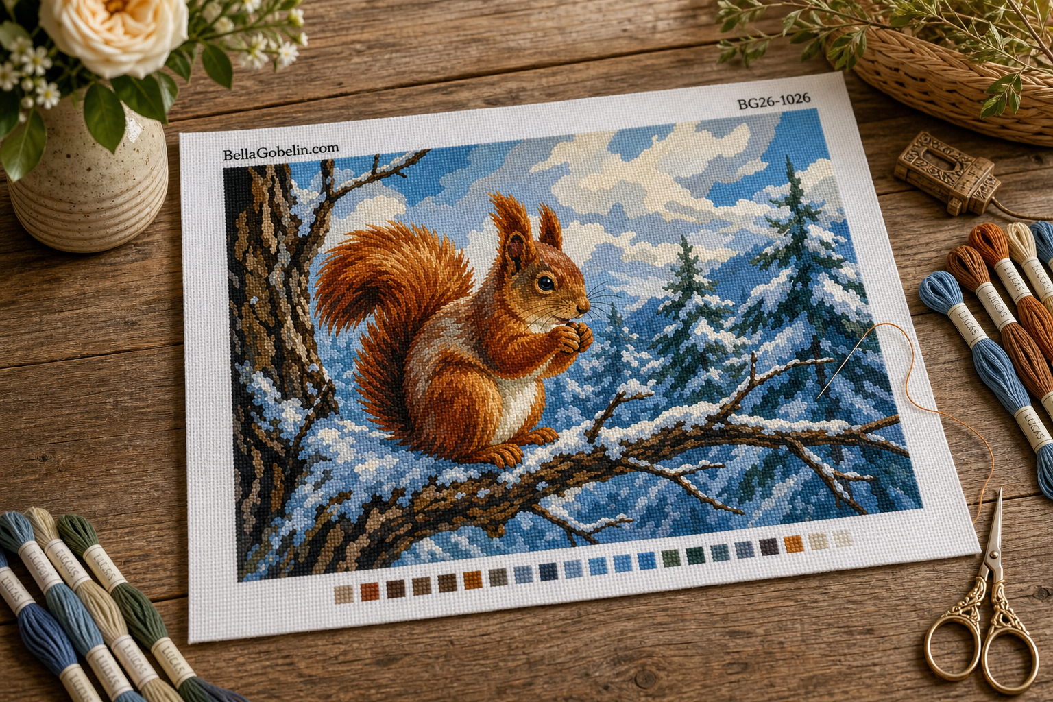 Eichhörnchen auf einem schneebedeckten Ast