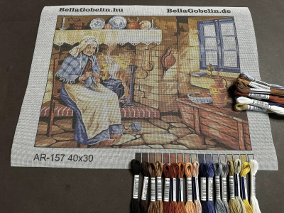 Eine alte Frau näht.